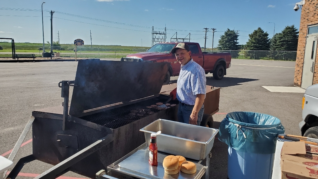 Board President Smith grilling for the picnic.