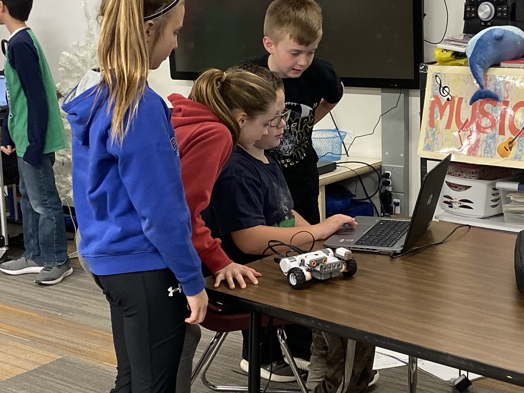 Students writing code for their robot.